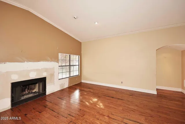 a view of kitchen with microwave and wooden floor