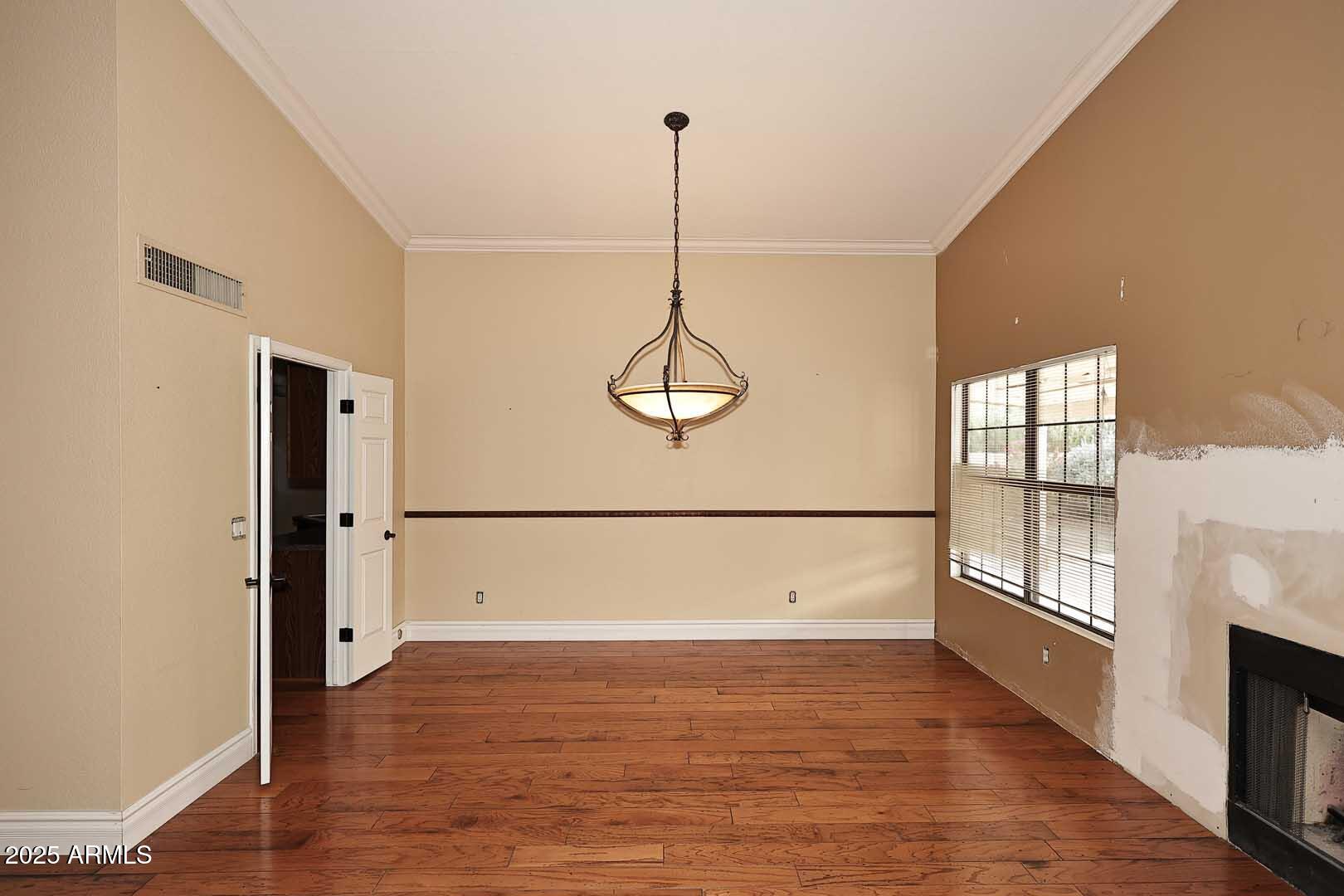 1971 East Buena Vista Drive Tempe, AZ 85284 - Photo 23 of 38 a view of a room with wooden floor and windows