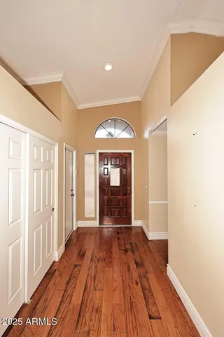 a bathroom with a double vanity sink a mirror and a bathtub
