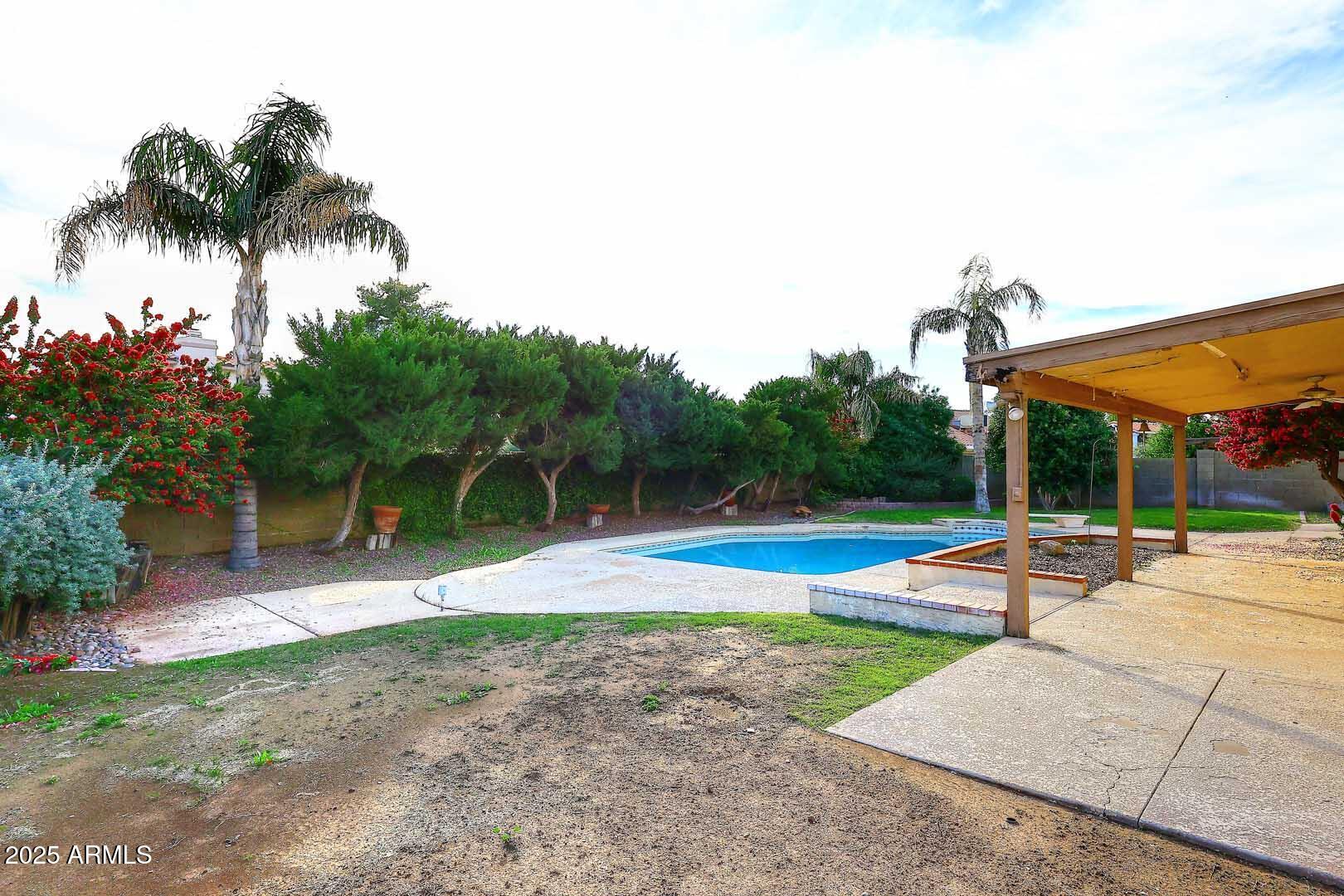 1971 East Buena Vista Drive Tempe, AZ 85284 - Photo 5 of 38 a backyard of a house with table and chairs
