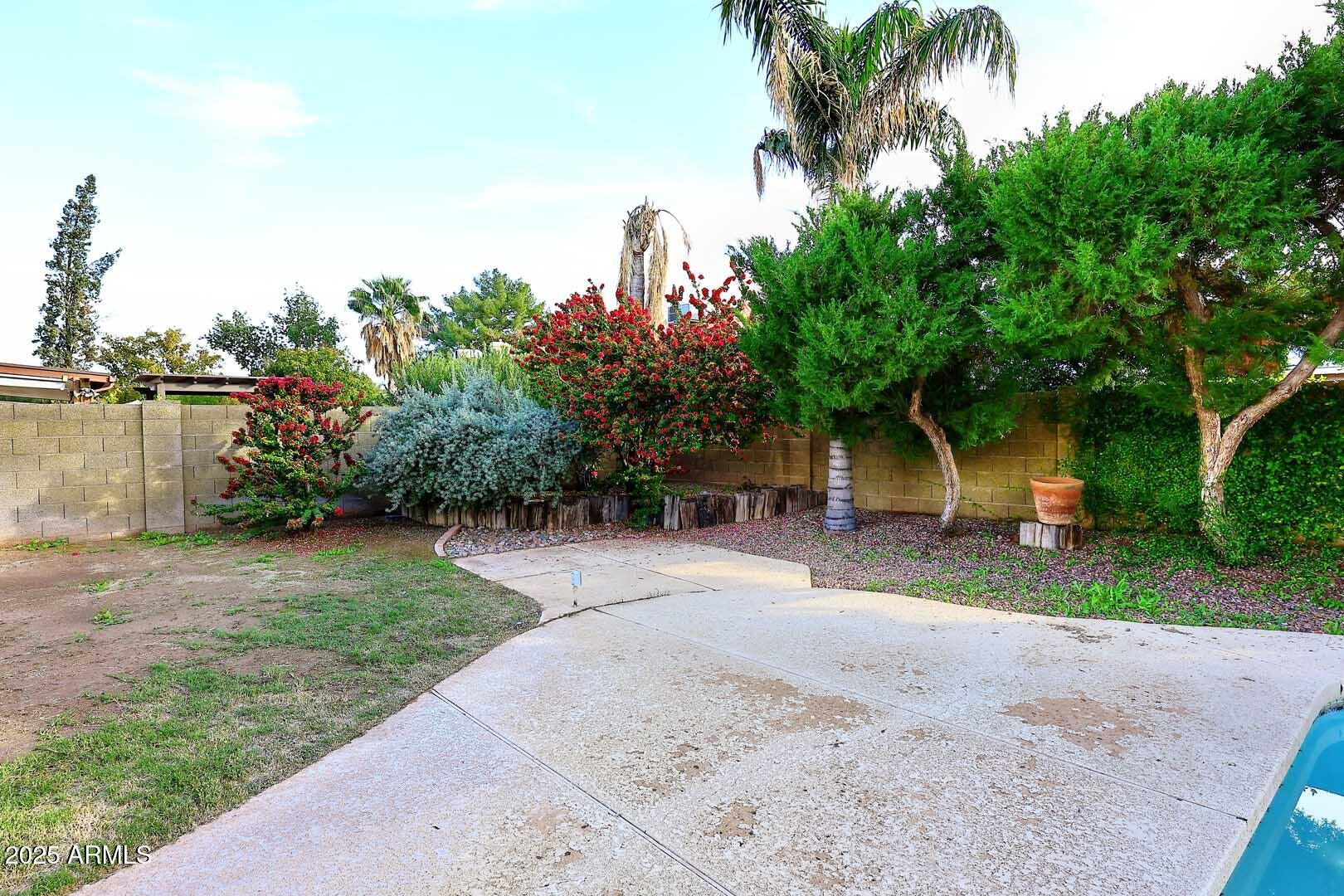 1971 East Buena Vista Drive Tempe, AZ 85284 - Photo 6 of 38 a front view of a house with a yard and a garage