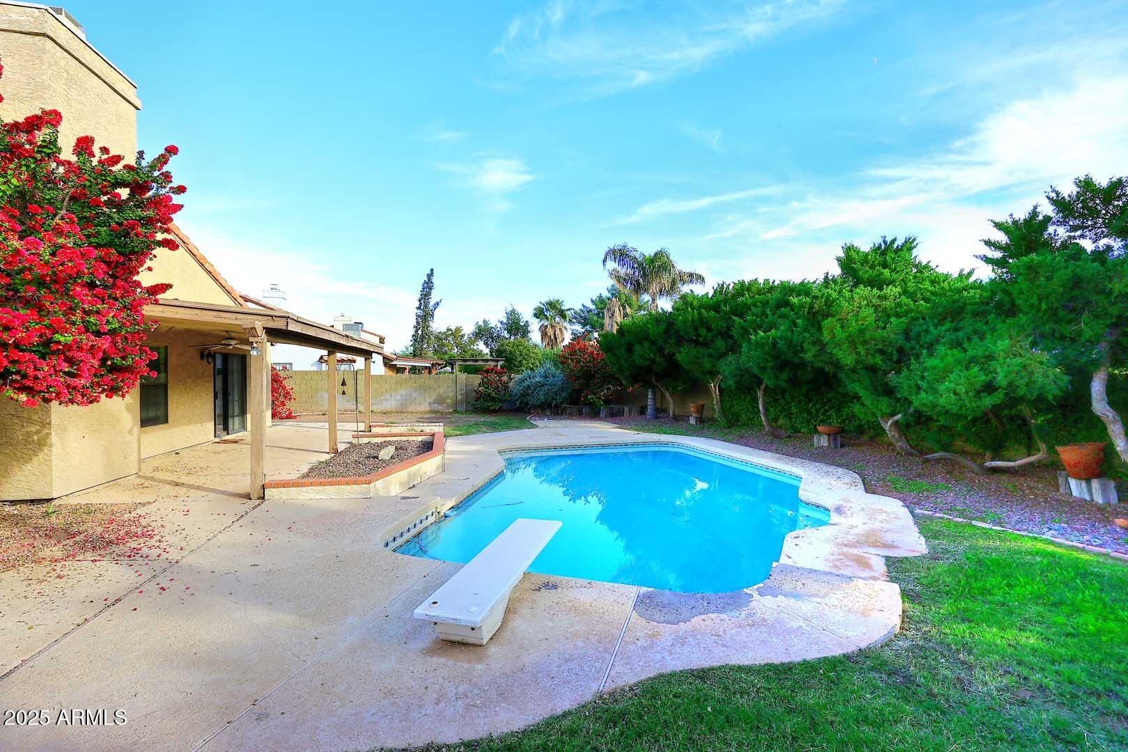 1971 East Buena Vista Drive Tempe, AZ 85284 - Photo 8 of 38 a swimming pool with barbeque oven outdoor seating and yard