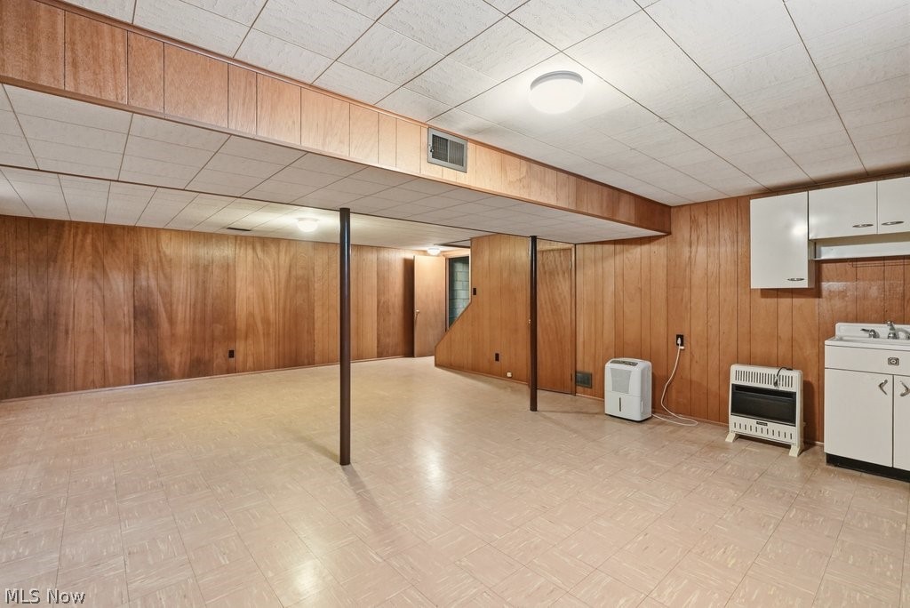 161 Pinehurst Road Munroe Falls, OH 44262 - Photo 30 of 40 Spacious lower level featuring wood paneling, drop ceiling with flush-mount lighting, and durable flooring