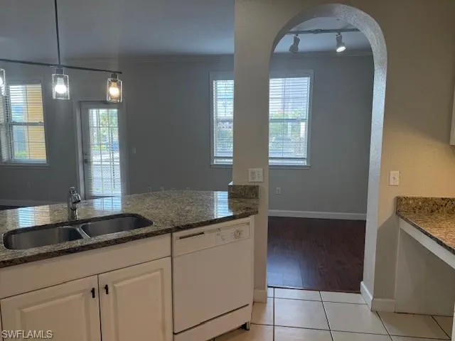 a kitchen with a stove and a white refrigerator