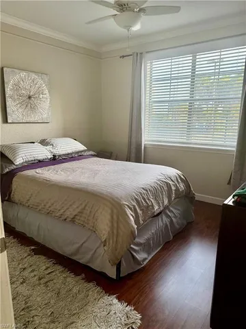 an empty room with wooden floor and closet