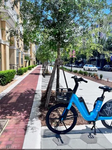 a living room with furniture and a mirror