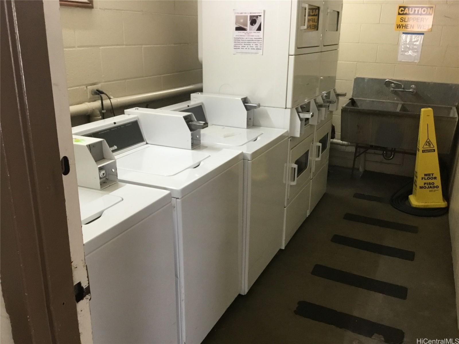 1440 Ward Avenue, Unit 301 Honolulu, HI 96822 - Photo 13 of 14 a utility room with dryer and washer