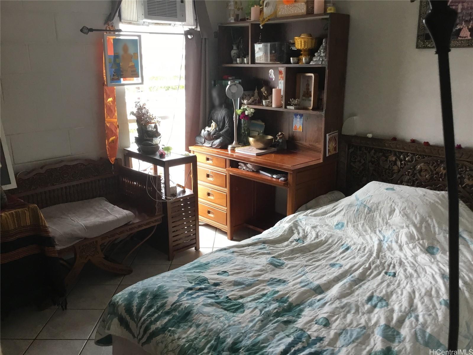 1440 Ward Avenue, Unit 301 Honolulu, HI 96822 - Photo 6 of 14 a bedroom with a bed and a window