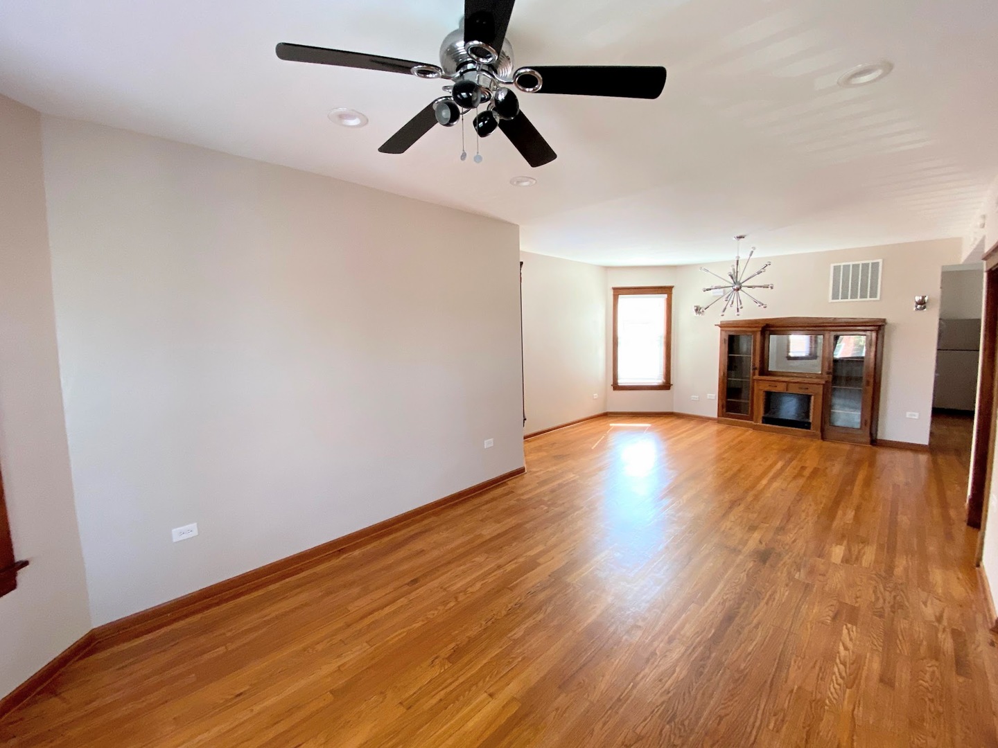 2328 North Kostner Avenue, Unit 2 Chicago, IL 60639 - Photo 6 of 10 a view of empty room with wooden floor