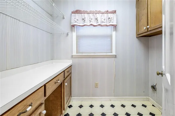 a bathroom with a sink toilet vanity and mirror