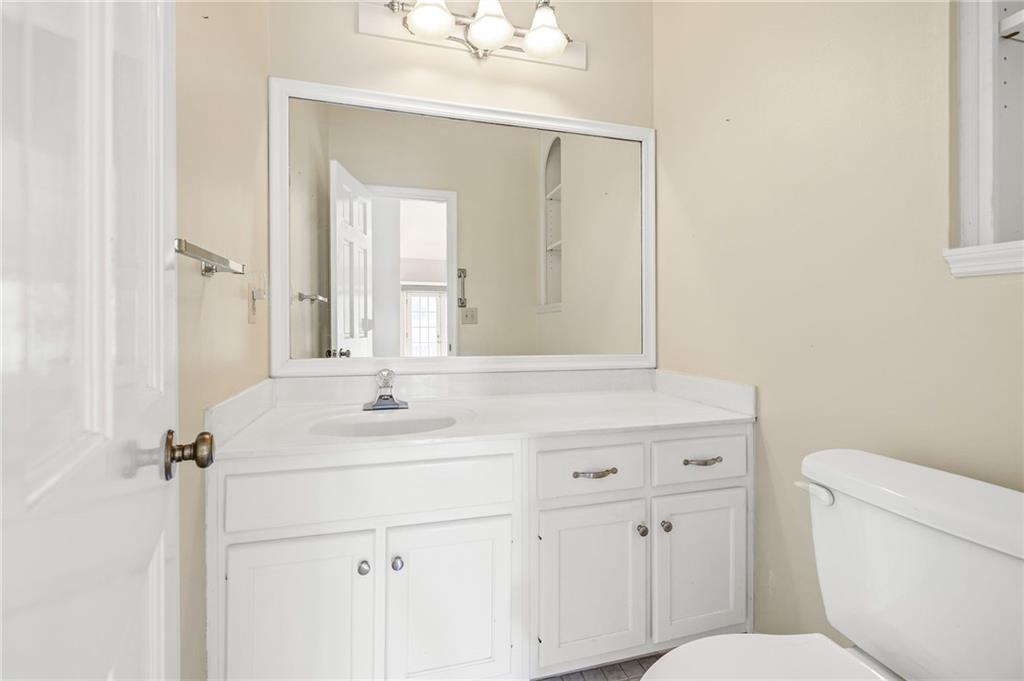 3374 Floral Court Suwanee, GA 30024 - Photo 17 of 54 a bathroom with a sink toilet vanity and mirror