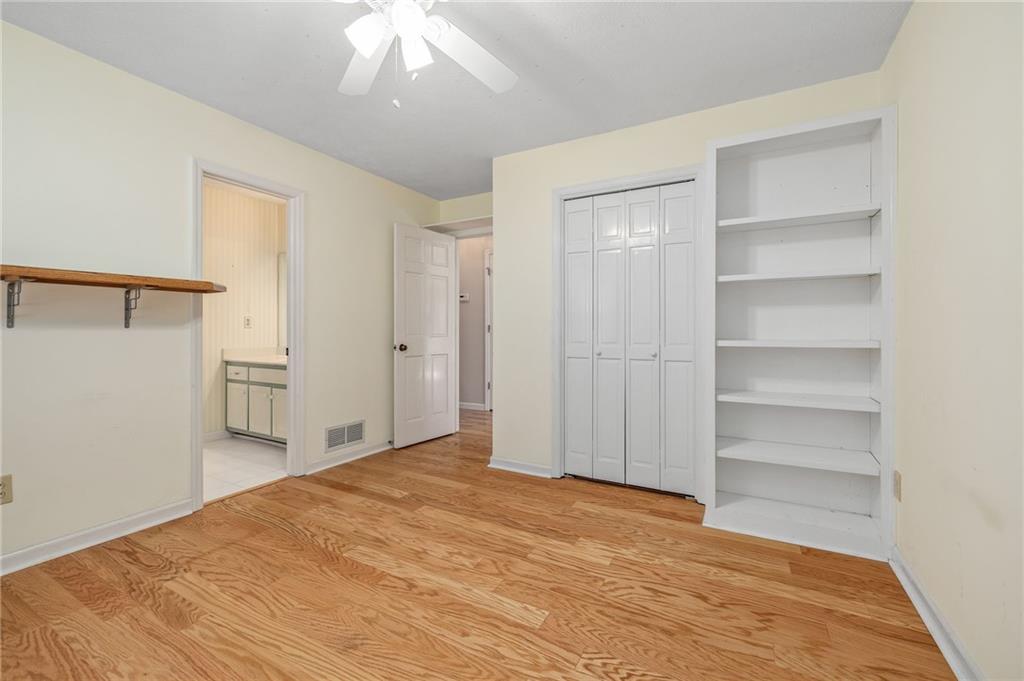 3374 Floral Court Suwanee, GA 30024 - Photo 26 of 54 a view of a bedroom with closet area