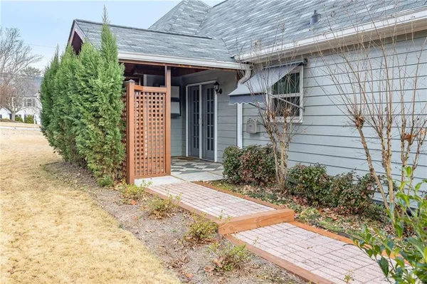 a front view of a house with garden