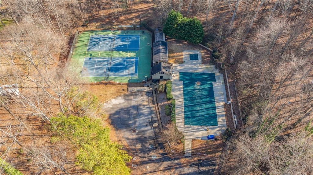 3374 Floral Court Suwanee, GA 30024 - Photo 51 of 54 a backyard of a house with large trees