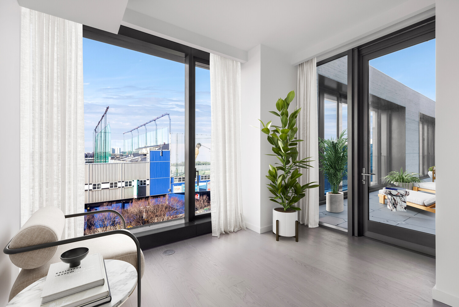 500 West 18th Street, Unit 5C Manhattan, NY 10011 - Photo 6 of 9 a bedroom with furniture and a potted plant