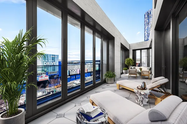 a bedroom with a bed couch and painting on the wall