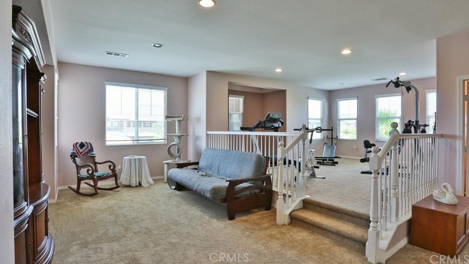 30240 Lamplighter Lane Menifee, CA 92584 - Photo 11 of 20 a living room with furniture and a large window
