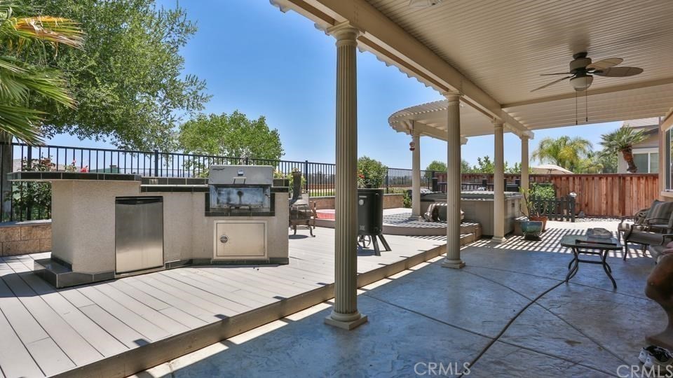 30240 Lamplighter Lane Menifee, CA 92584 - Photo 12 of 20 a view of a patio with a table and chairs
