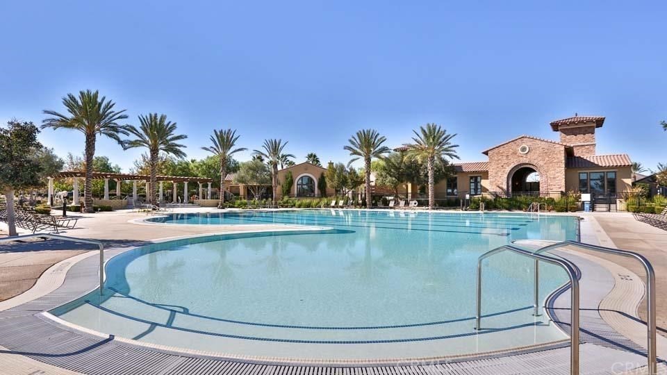 30240 Lamplighter Lane Menifee, CA 92584 - Photo 15 of 20 a view of swimming pool with outdoor seating and house in the background