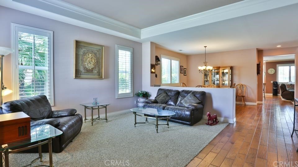 30240 Lamplighter Lane Menifee, CA 92584 - Photo 7 of 20 a living room with furniture and a large window