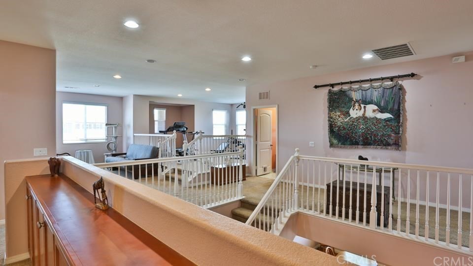 30240 Lamplighter Lane Menifee, CA 92584 - Photo 9 of 20 a view of a dining room with furniture window and wooden floor