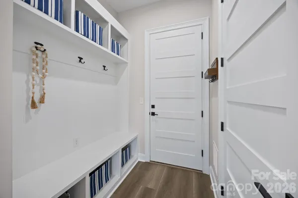 a view of an entryway with wooden floor