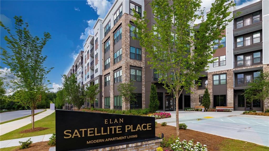 3100 Commerce Avenue Northwest, Unit C1 Duluth, GA 30096 - Photo 2 of 27 a view of tall buildings and street