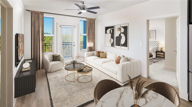 a living room with furniture and a large window