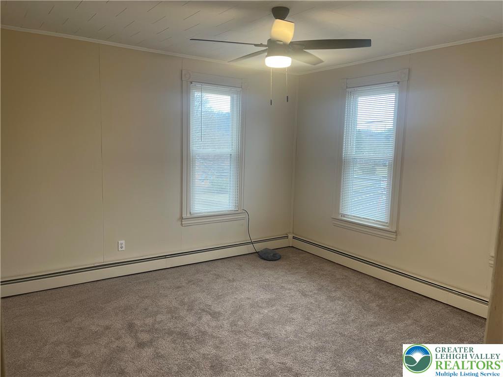 1053 Rising Sun Road Laurys Station, PA 18059 - Photo 13 of 16 an empty room with windows and fan