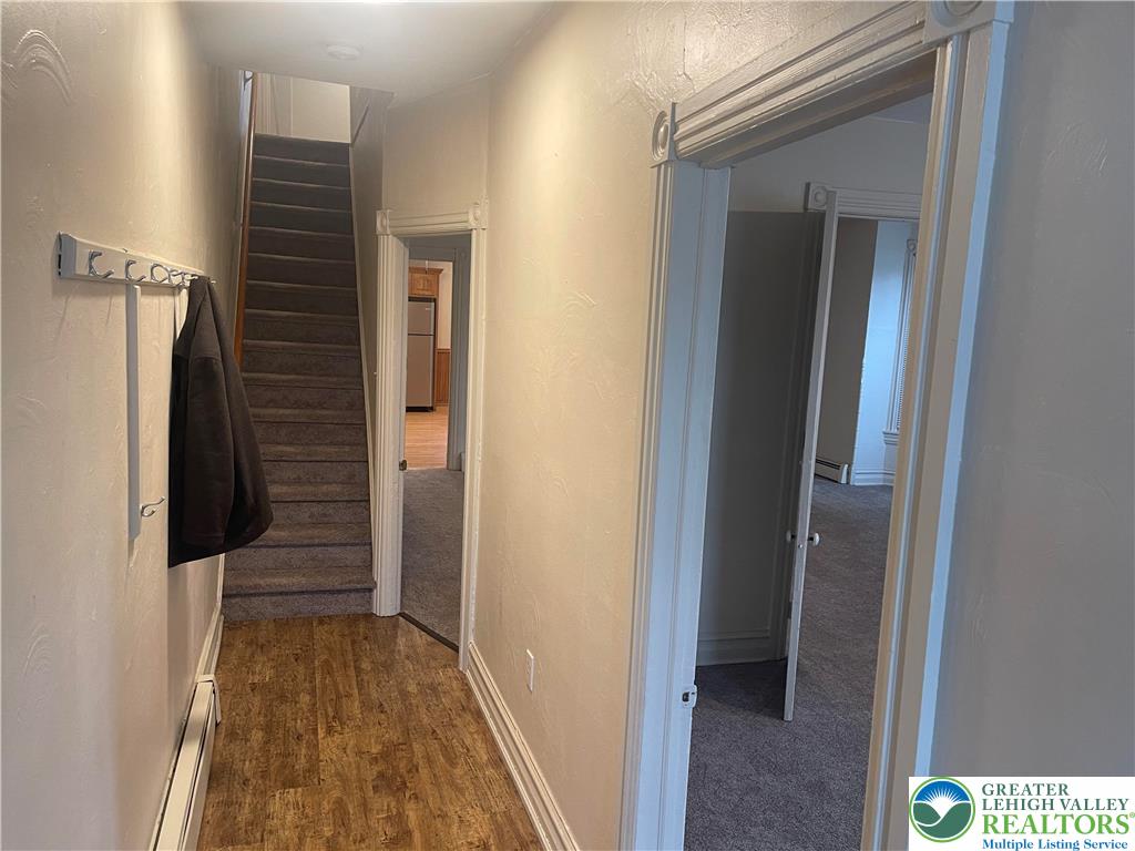 1053 Rising Sun Road Laurys Station, PA 18059 - Photo 2 of 16 a view of a hallway with wooden floor and staircase