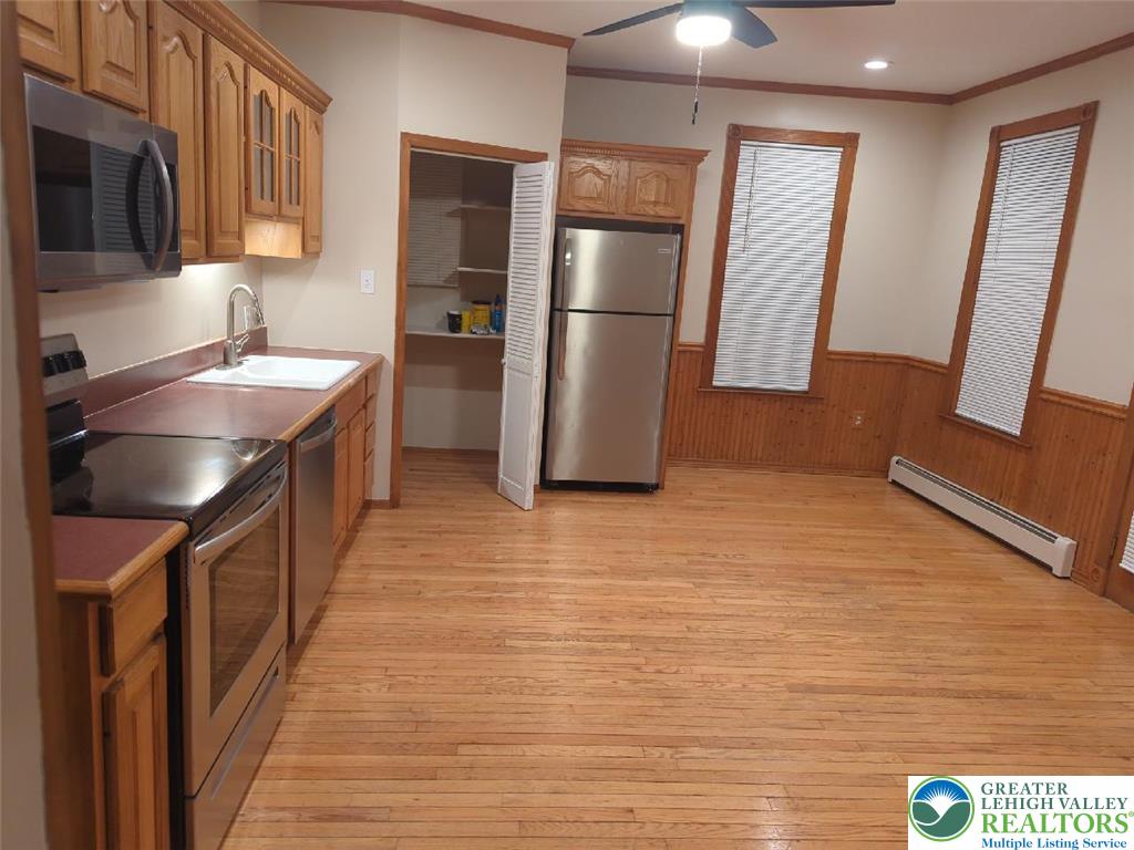 1053 Rising Sun Road Laurys Station, PA 18059 - Photo 6 of 16 a kitchen with stainless steel appliances granite countertop a refrigerator a sink and a stove