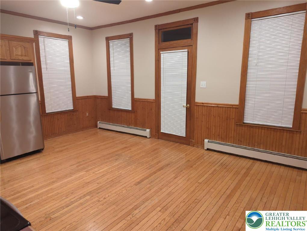 1053 Rising Sun Road Laurys Station, PA 18059 - Photo 7 of 16 a view of an empty room with wooden floor and a window
