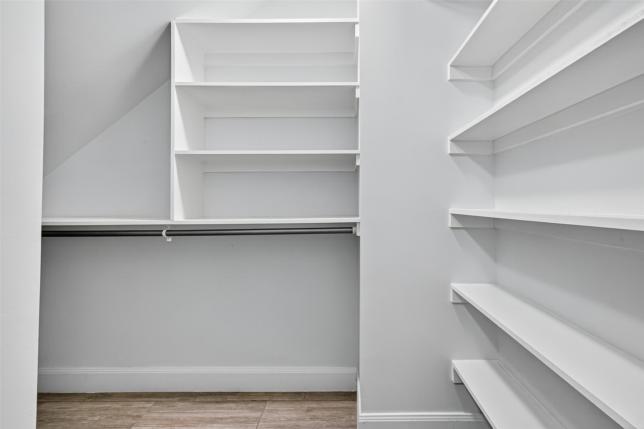 818 Silvergate Drive Houston, TX 77079 - Photo 26 of 40 a view of walk in closet with empty racks