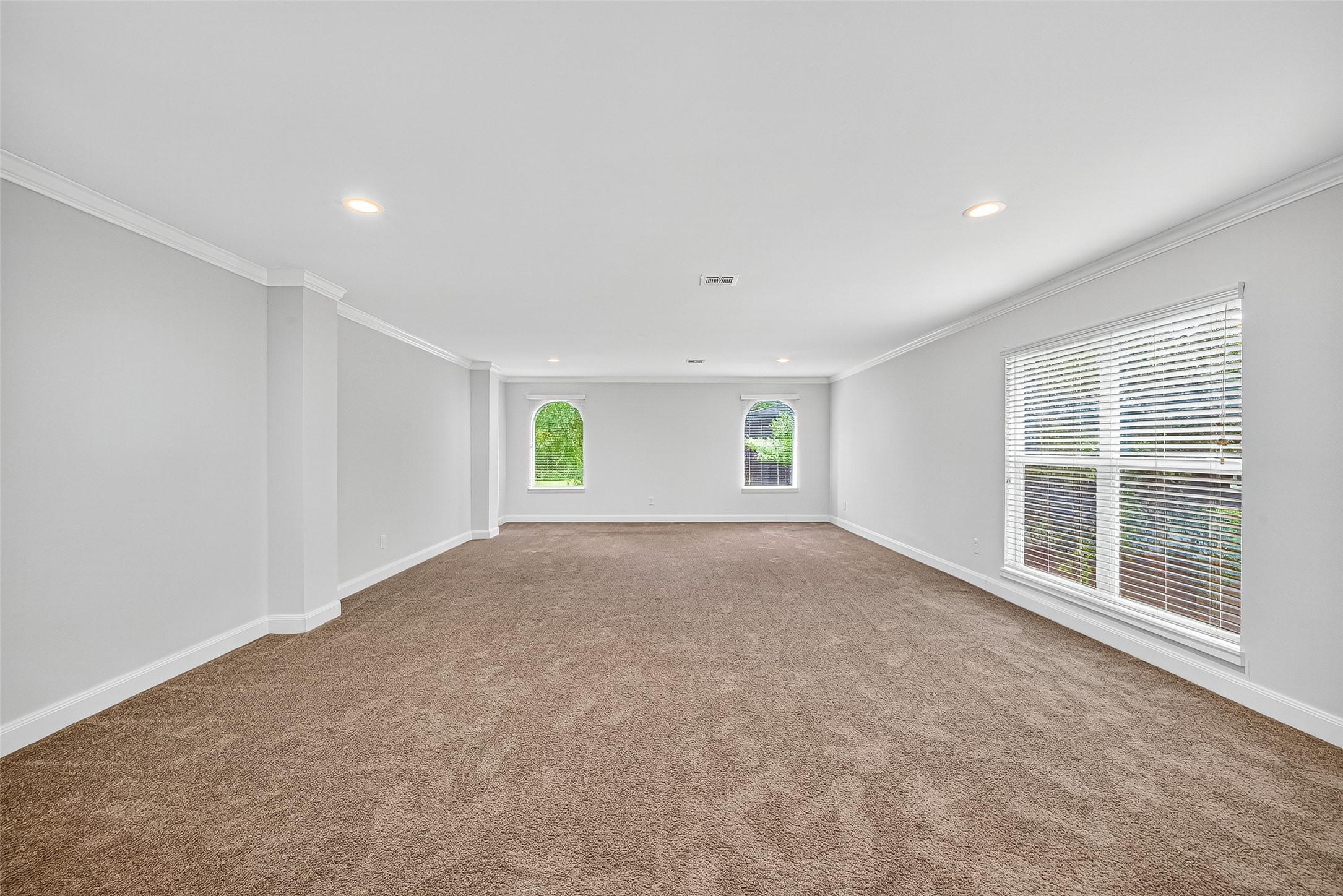 818 Silvergate Drive Houston, TX 77079 - Photo 28 of 40 a view of a big room with windows and chandelier fan