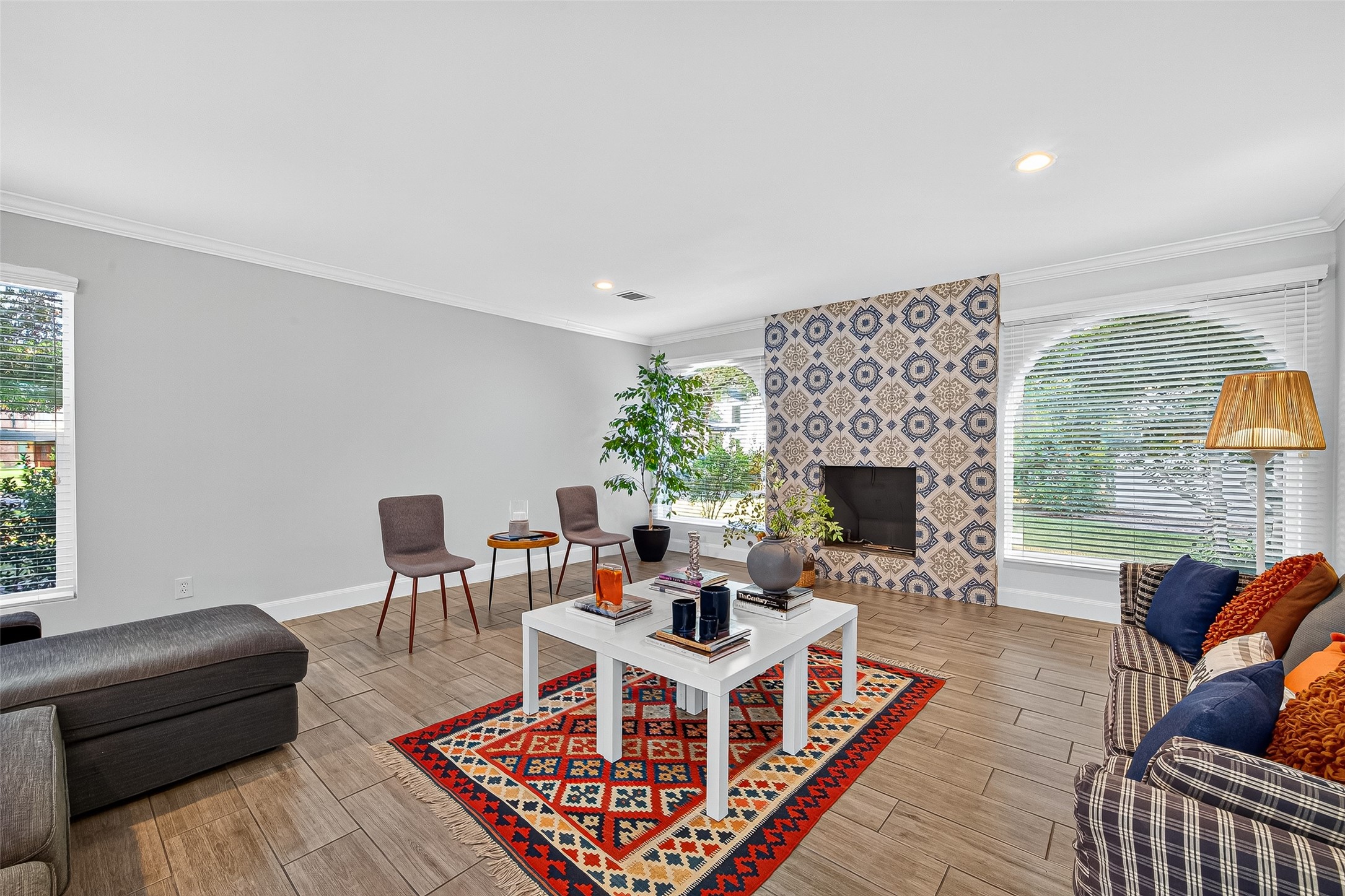 818 Silvergate Drive Houston, TX 77079 - Photo 6 of 40 a living room with furniture a rug and a fireplace