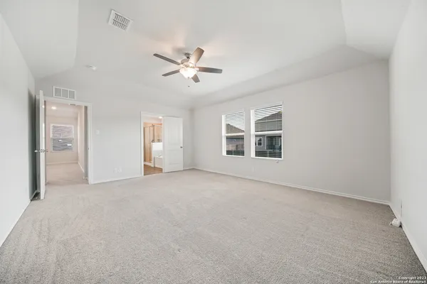 a view of empty room with windows