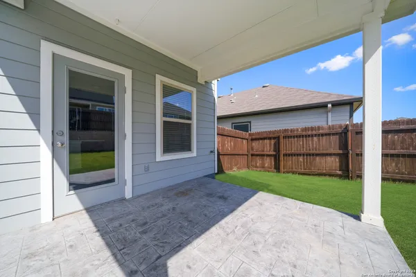 a view of a house with a yard and porch