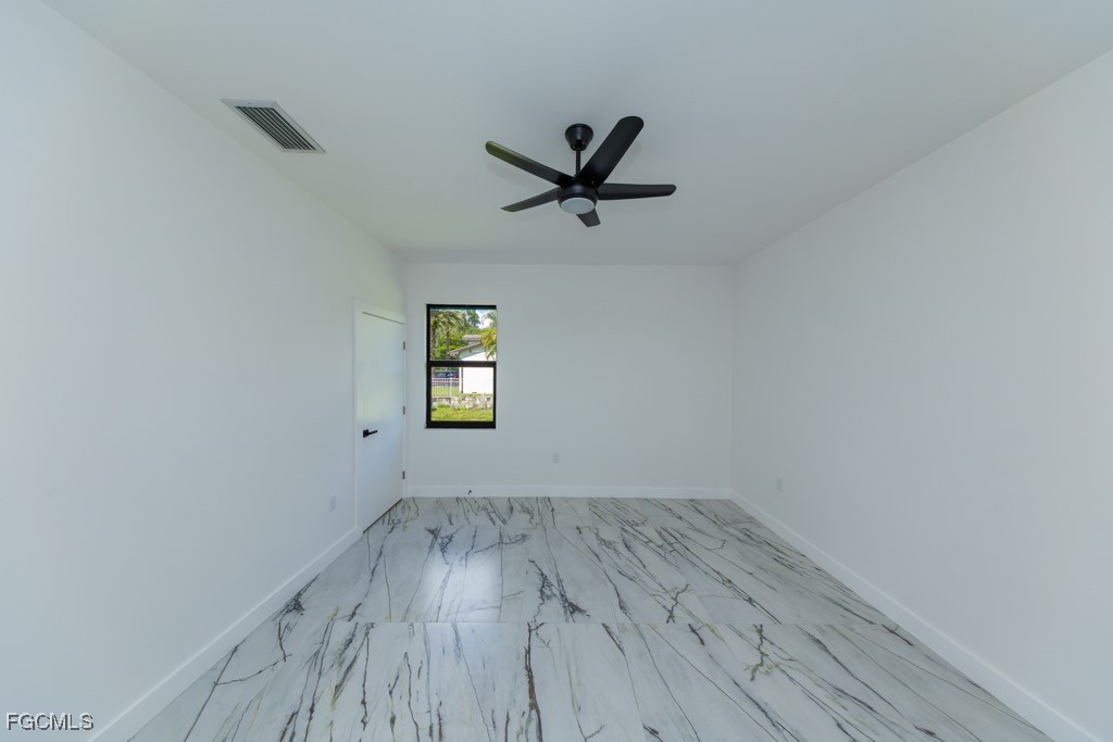 2006 Truman Avenue Alva, FL 33920 - Photo 19 of 45 a view of empty room with wooden floor and fan