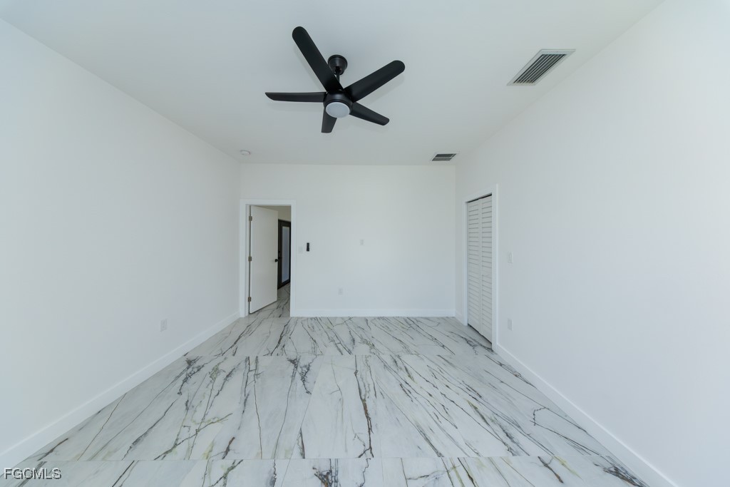 2006 Truman Avenue Alva, FL 33920 - Photo 20 of 45 a view of empty room with wooden floor and ceiling fan
