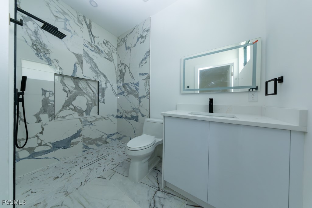 2006 Truman Avenue Alva, FL 33920 - Photo 21 of 45 a bathroom with a toilet sink and mirror