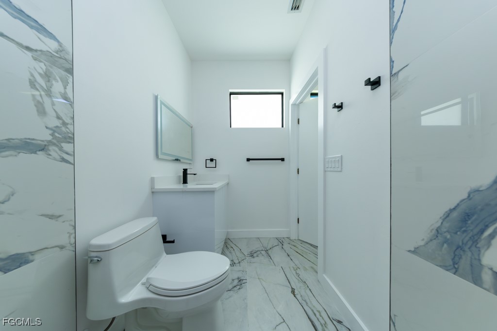 2006 Truman Avenue Alva, FL 33920 - Photo 23 of 45 a bathroom with a toilet sink and shower