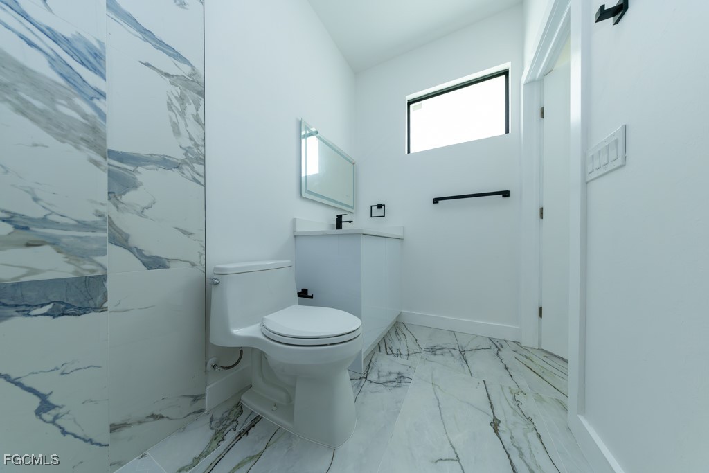 2006 Truman Avenue Alva, FL 33920 - Photo 24 of 45 a bathroom with a sink and a toilet