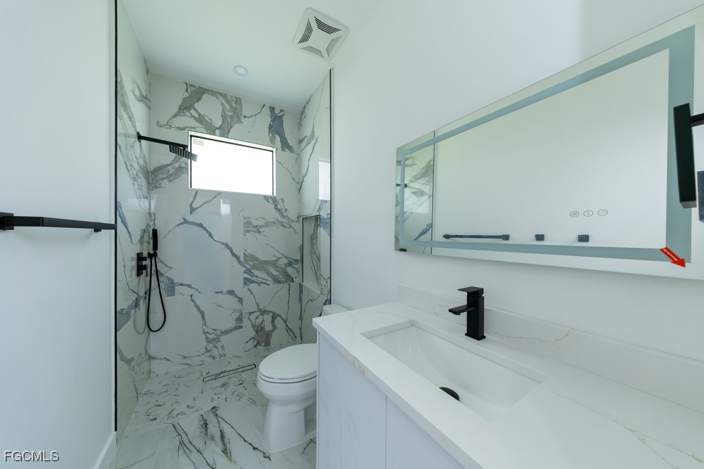 2006 Truman Avenue Alva, FL 33920 - Photo 27 of 45 a bathroom with a sink a toilet and shower