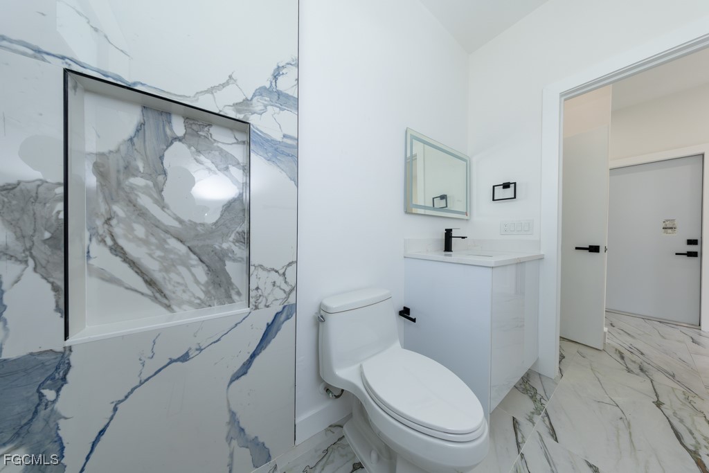 2006 Truman Avenue Alva, FL 33920 - Photo 30 of 45 a bathroom with a toilet and a shower