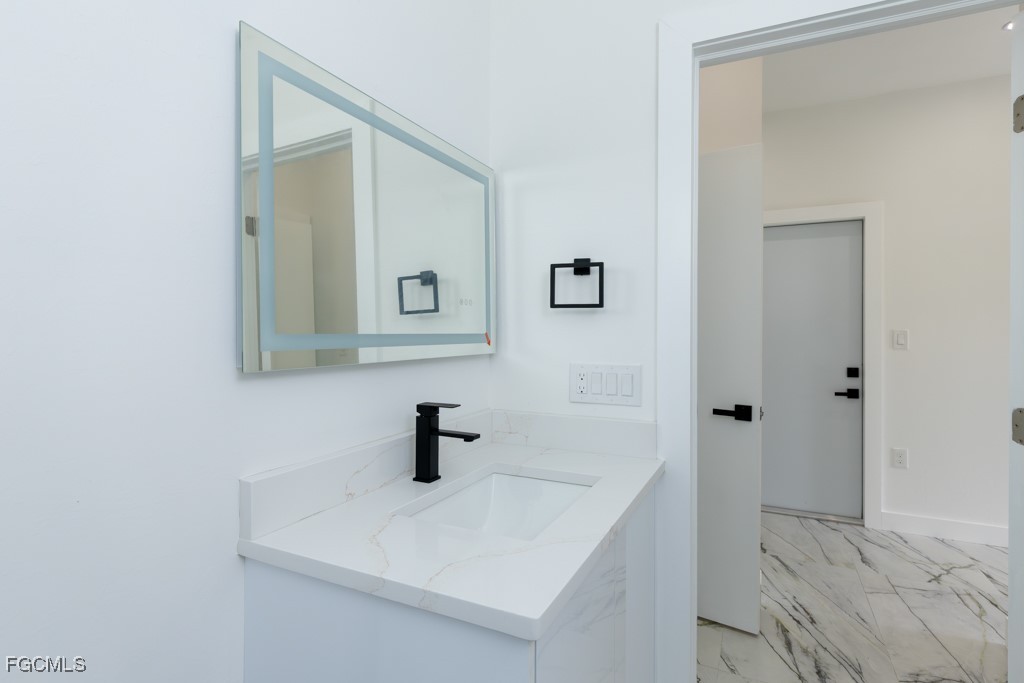 2006 Truman Avenue Alva, FL 33920 - Photo 31 of 45 a bathroom with a sink and mirror