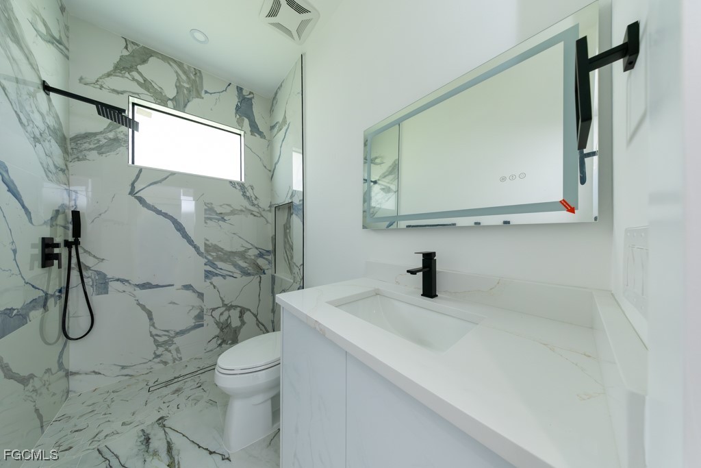 2006 Truman Avenue Alva, FL 33920 - Photo 32 of 45 a bathroom with a sink toilet and shower