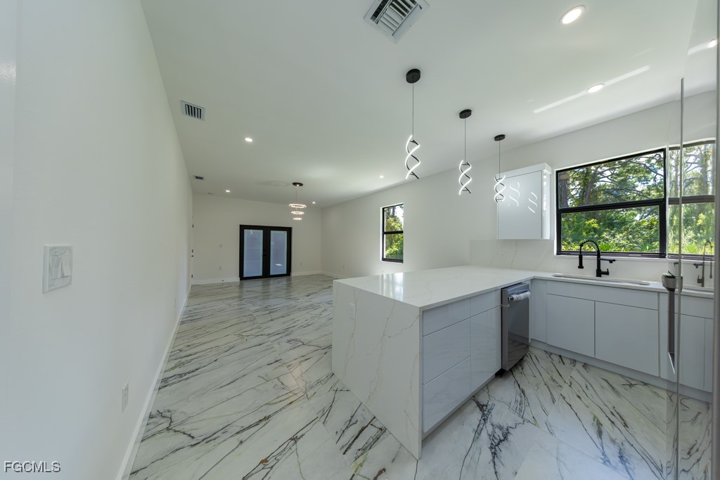 2006 Truman Avenue Alva, FL 33920 - Photo 4 of 45 a large kitchen with a lot of counter space and a sink