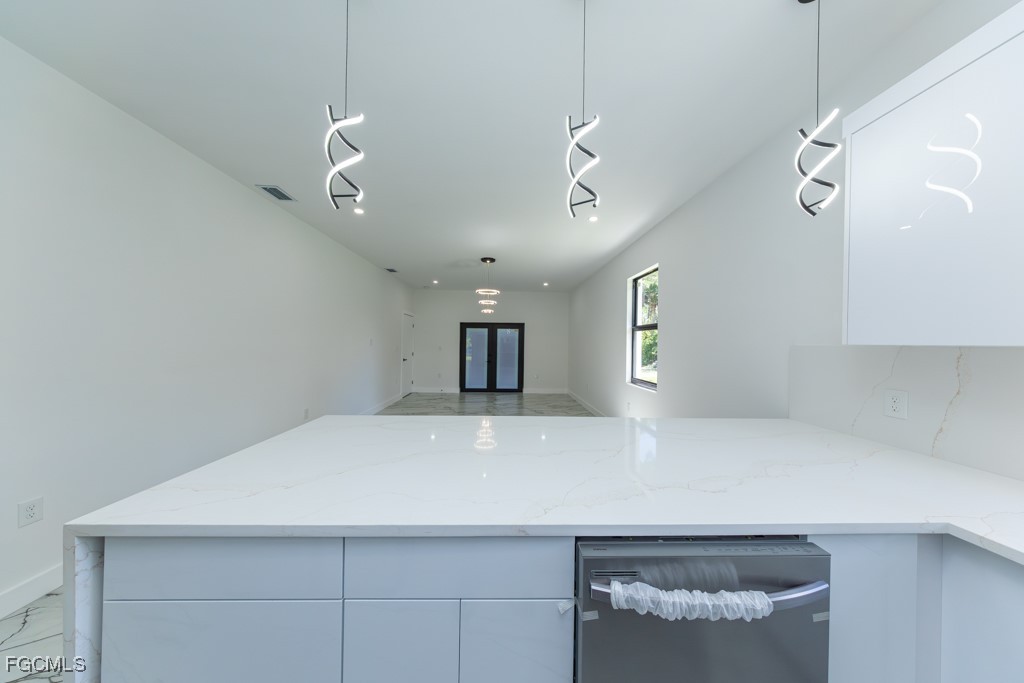 2006 Truman Avenue Alva, FL 33920 - Photo 10 of 45 a view of a kitchen with a sink and chandelier
