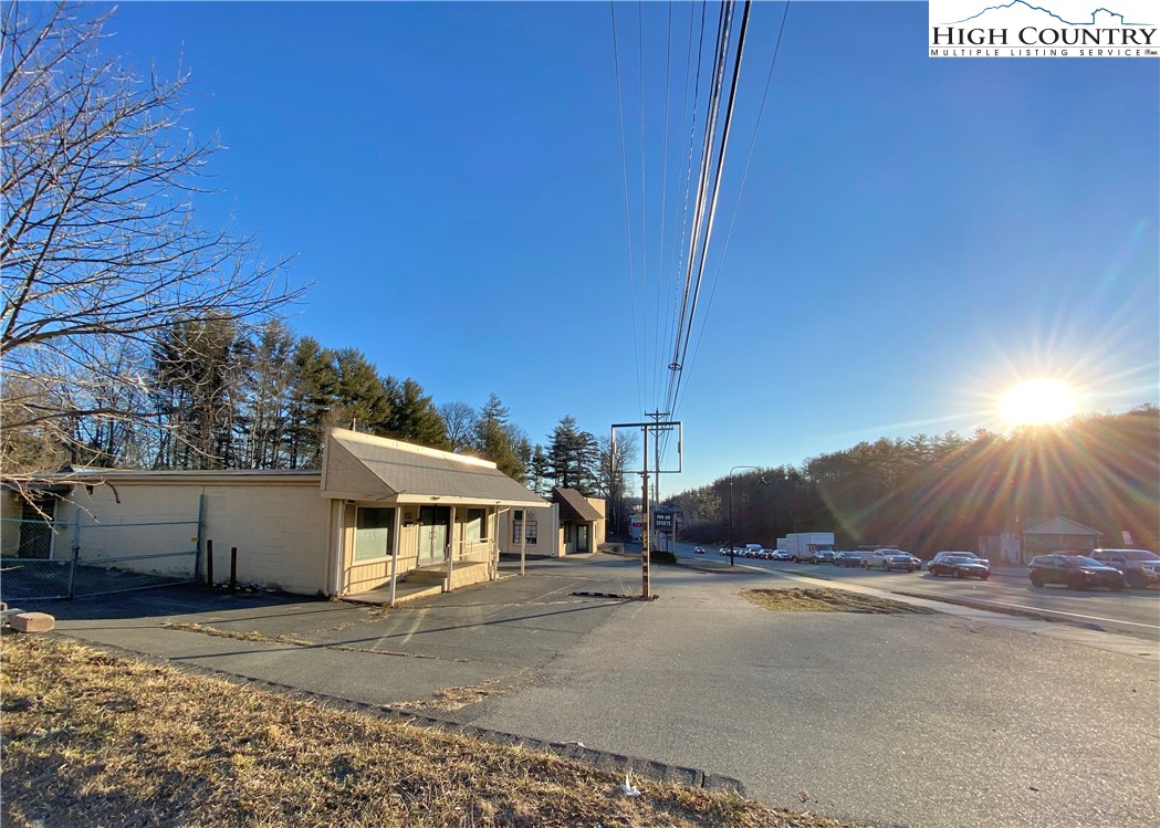 499-511 East King Street Boone, NC 28607 - Photo 7 of 12 a view of a house with a yard and garage