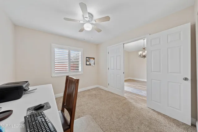 an aerial view of a house with a garden and lake view